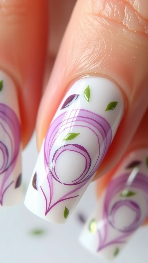 Close-up of onion-inspired nail art with purple and green designs on white nails.
